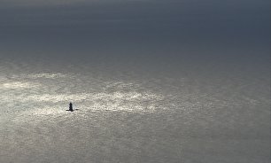 Leuchtturm im Meer Wandbild