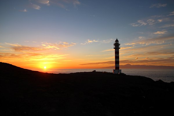 Sonnenuntergang mit Leuchtturm Wandbild