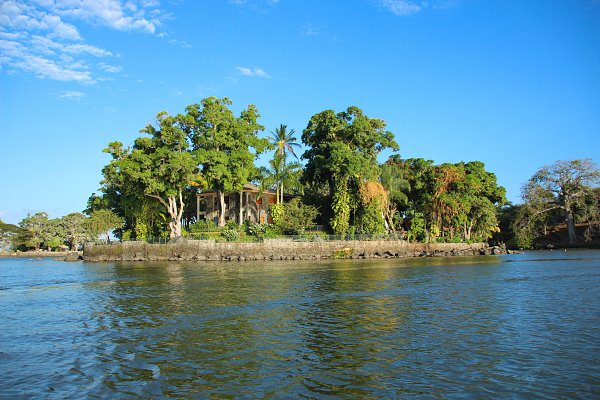 Insel mit Luxusvilla Wandbild
