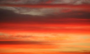 Orangerote Wolken Wandbild